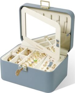 Blue jewelry box with mirror and cream interior trays