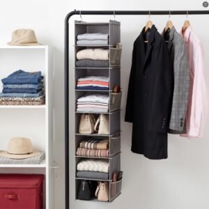 Hanging shoe organizer in a wardrobe beside clothes