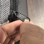 Custom zipper pull for fabric storage products