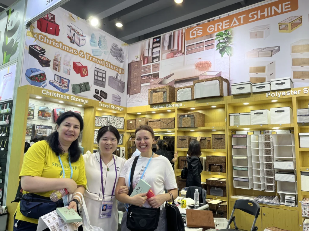 Great Shine team and visitors at a home storage products booth