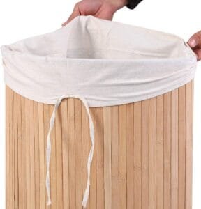Drawstring fabric liner inside a bamboo laundry basket