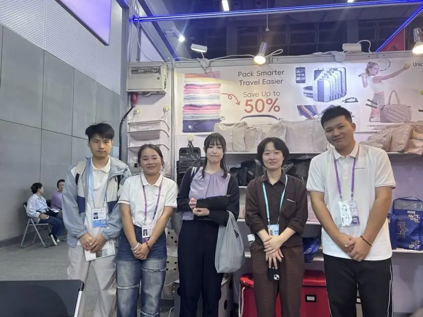 Great Shine team and visitors at a storage products exhibition