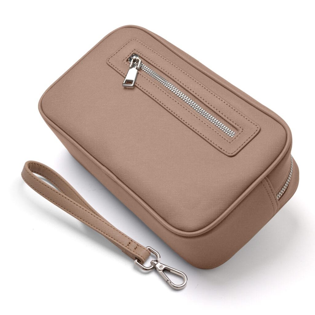 Cosmetic bag handle and wrist strap detail