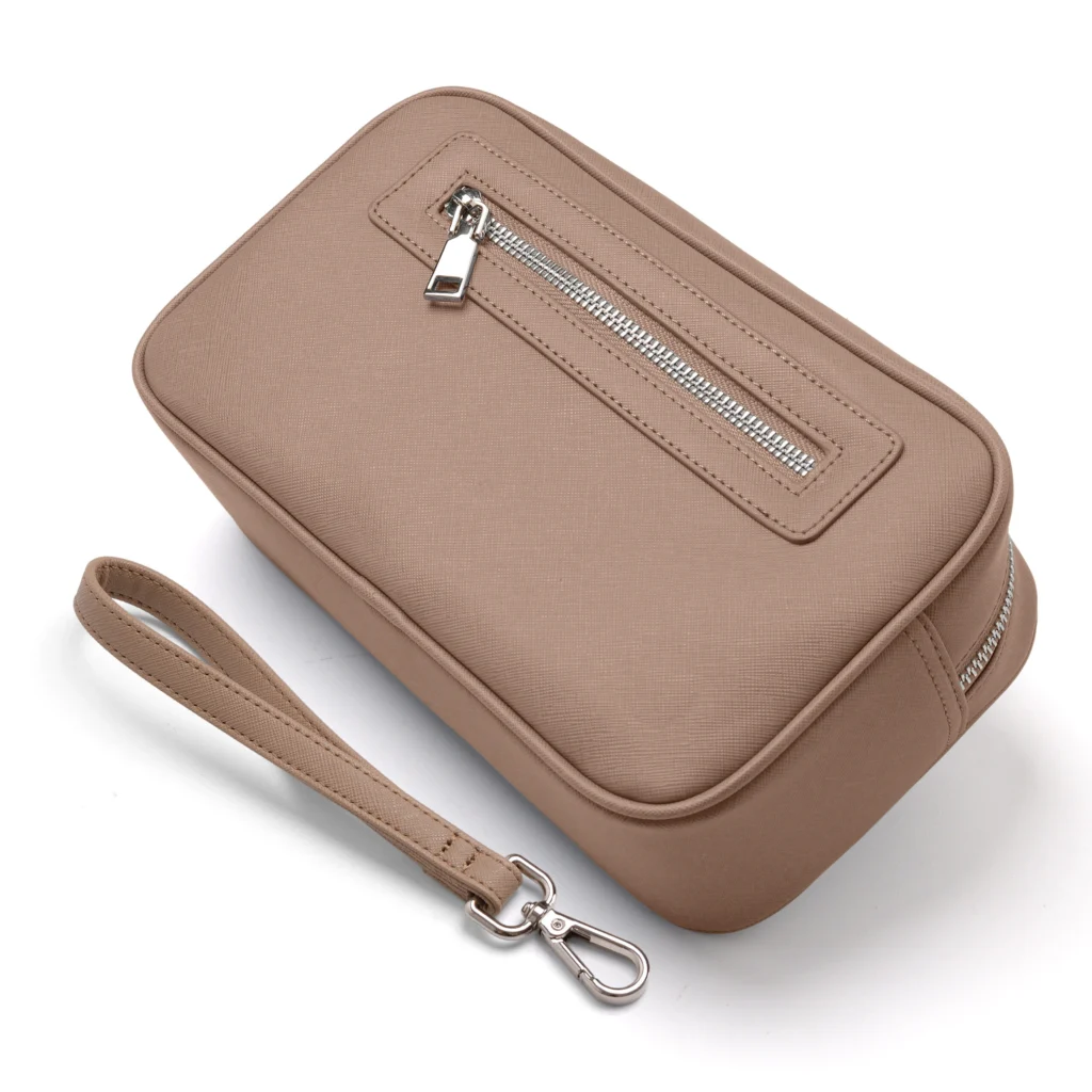 Cosmetic bag handle and wrist strap detail