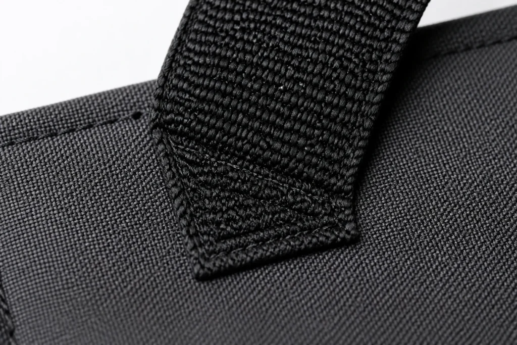 Macro close-up of bartack stitching at a handle attachment point